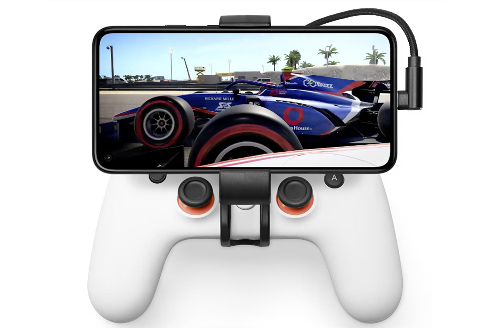 Google Pixel phone held by a Stadia Controller grip.