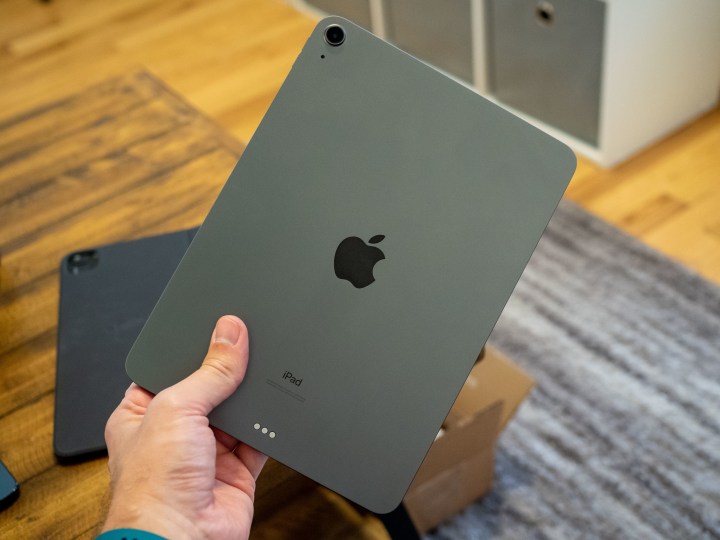 A person holding the iPad Air 4.