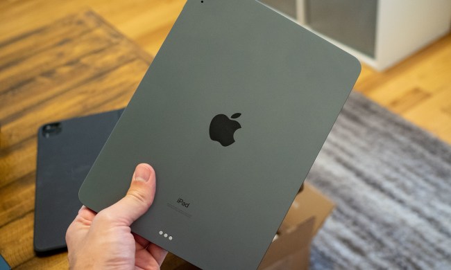 A person holding the iPad Air 4.