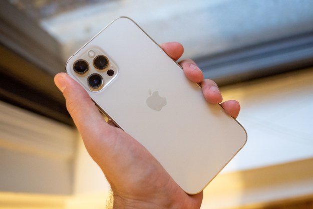 The iPhone 12 Pro Max in-hand.