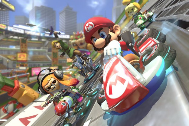 Mario, Link, Isabelle, and a Squid Kid race down the track in Mario Kart 8 Deluxe for the Nintendo Switch.