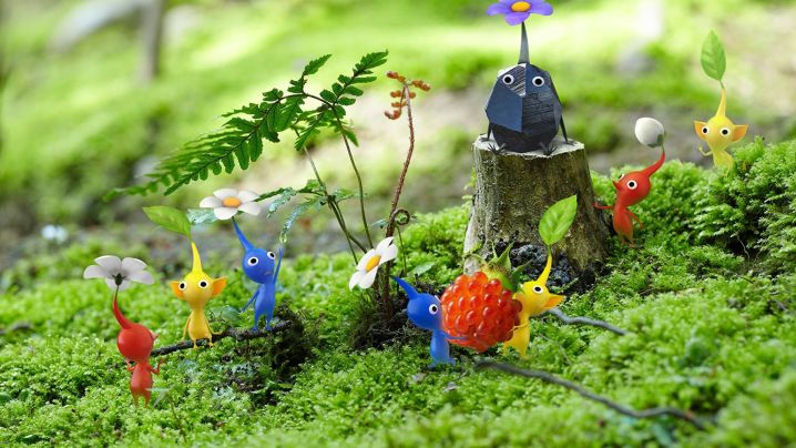 Several Pikmin on grass, posing for promo material for Pikmin 3.