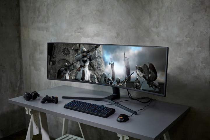 The Samsung 49-inch curved ultrawide monitor on a desk.