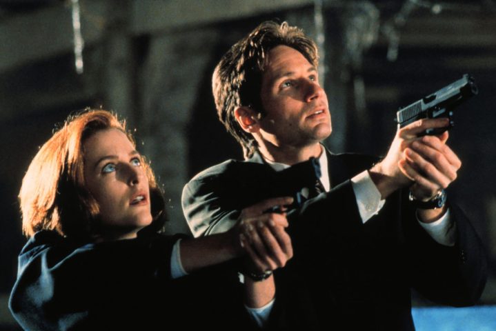 A man and a woman point guns up in The X-Files.