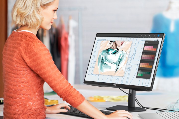 Woman using Dell 27-inch monitor.