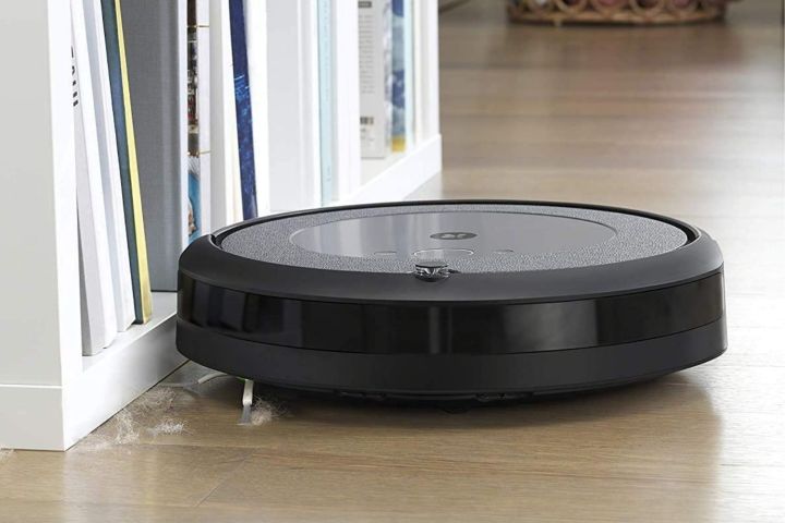 The iRobot Roomba i3 cleaning along base-trim.