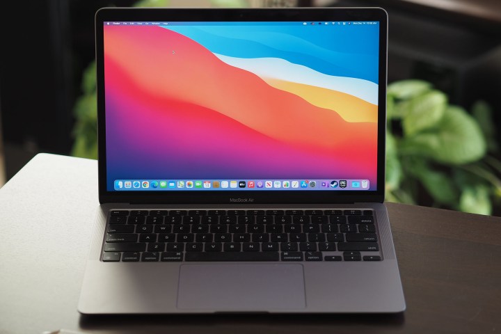 The M1-powered Macbook Air, open on a table.