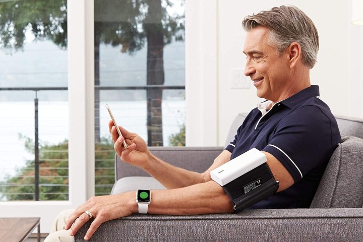 Middle-age man wearing the QardioArm Blood Pressure Monitor