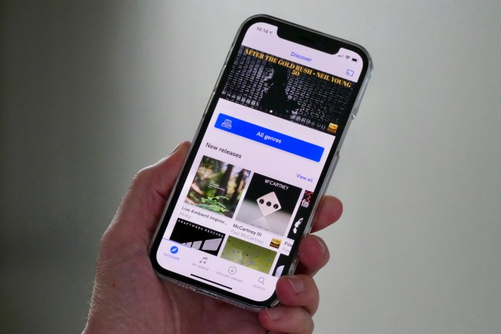 A person using the Qobuz app on an iPhone.