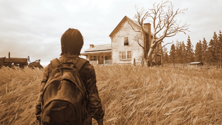 Ellie walks towards a house in The Last of Us Part II.