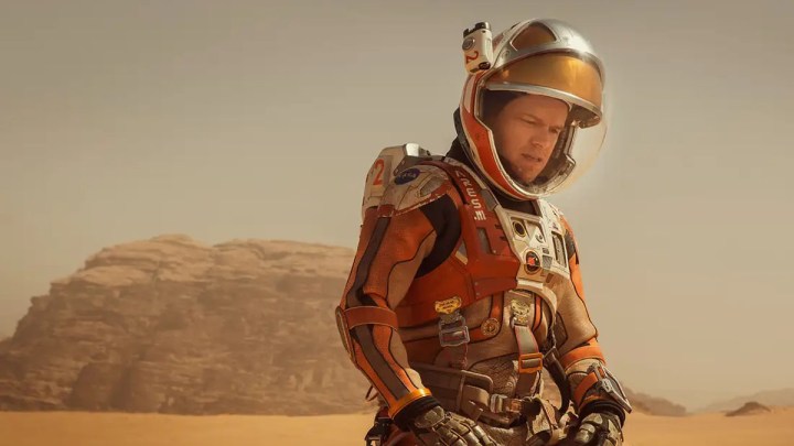 Matt Damon stands in his spacesuit on Mars in The Martian.