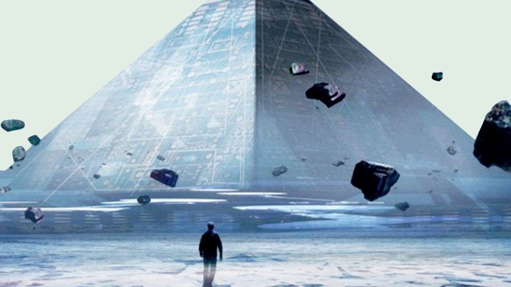Una pirámide con una figura caminando hacia ella.