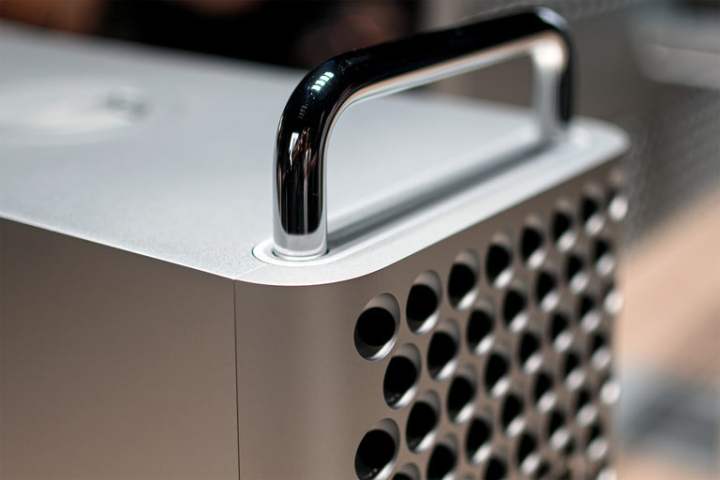 A close-up of Apple's Mac Pro from 2019 showing the front "cheesegrater" grill and top handle.