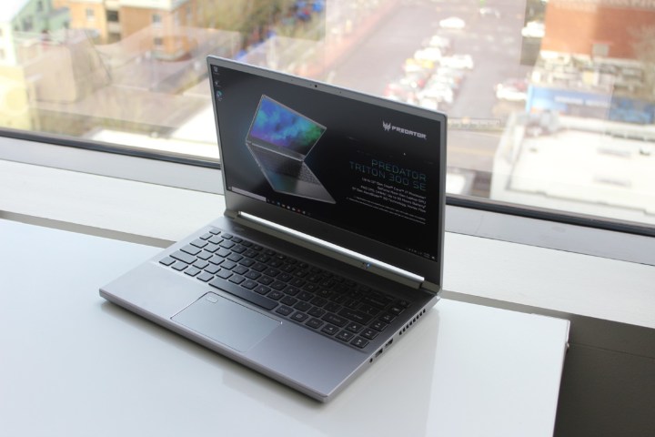 The Acer Predator Triton 300 gaming laptop near a window.