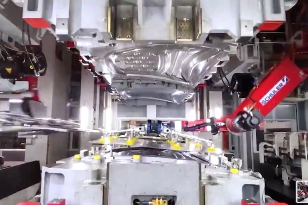 teslas mesmerizing video features frunk stamping robots tesla fremont factory robot