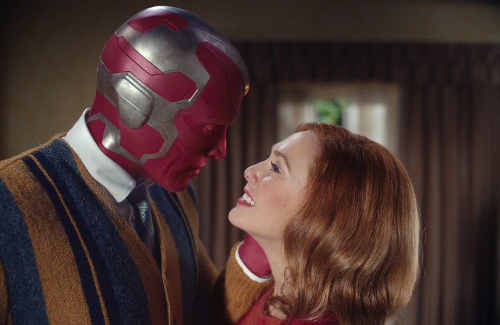 Paul Bettany and Elizabeth Olsen embrace in a scene from WandaVision.