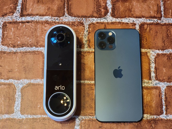 Size comparison between the Arlo Video Doorbell and an iPhone 12 Pro