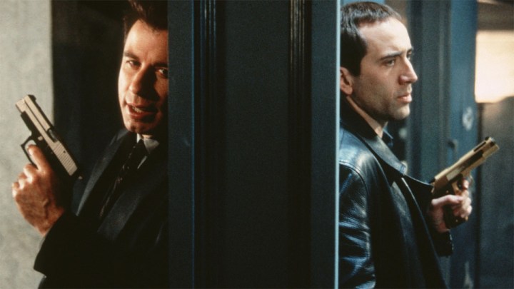 Sean and Castor having a conversation through a wall in Face/Off