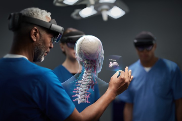 surgeons wear Hololens 2 headsets in the OR
