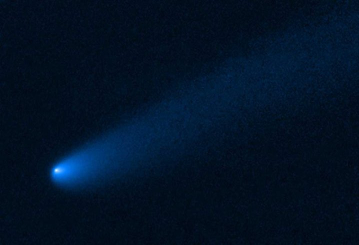 NASA's Hubble Space Telescope snapped this image of the young comet P/2019 LD2 as it orbits near Jupiter’s captured ancient asteroids, which are called Trojans. The Hubble view reveals a 400,000-mile-long tail of dust and gas flowing from the wayward comet's bright solid nucleus. 