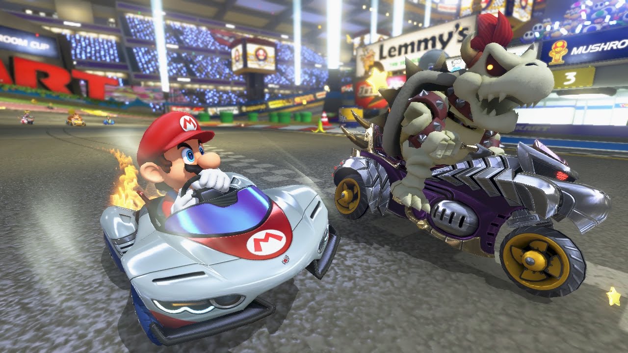 Mario and skeleton Bowser racing on the track.