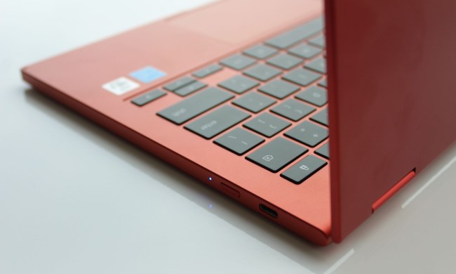 A red Samsung Galaxy Chromebook 2 sits open on a table.