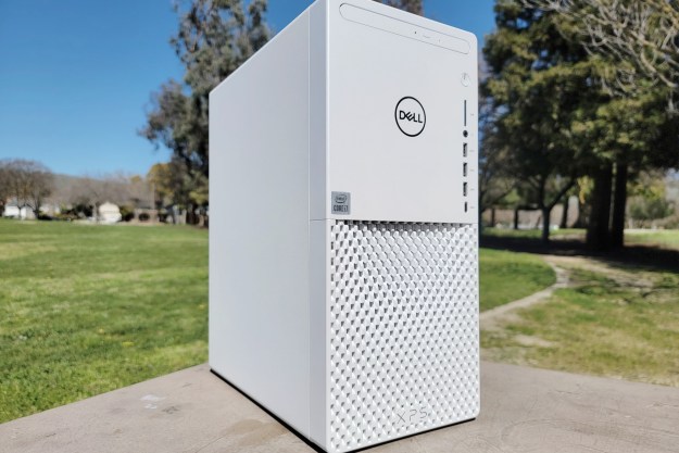 Dell XPS Desktop placed outdoors near some trees.