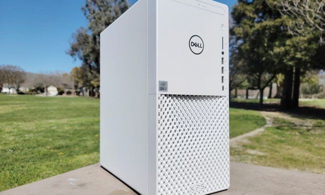 Dell XPS Desktop placed outdoors near some trees.