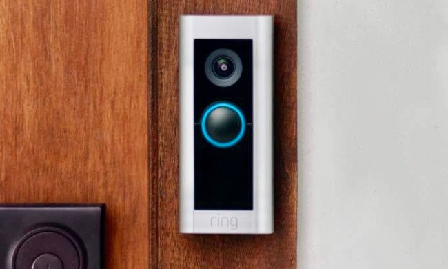 Ring Video Doorbell Pro 2 on a wooden door.