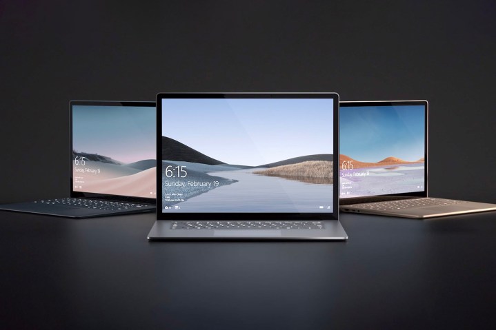The Microsoft Surface Laptop Go collection, with 3  laptops displaying landscapes connected  their screens.