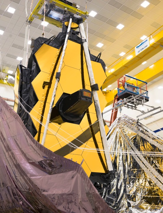 Both sides of the James Webb Space Telescope's sunshield were lifted vertically in preparation for the folding of the sunshield layers.