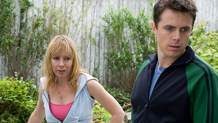 Amy Ryan and Casey Affleck looking in the same direction in the movie Gone Baby Gone.