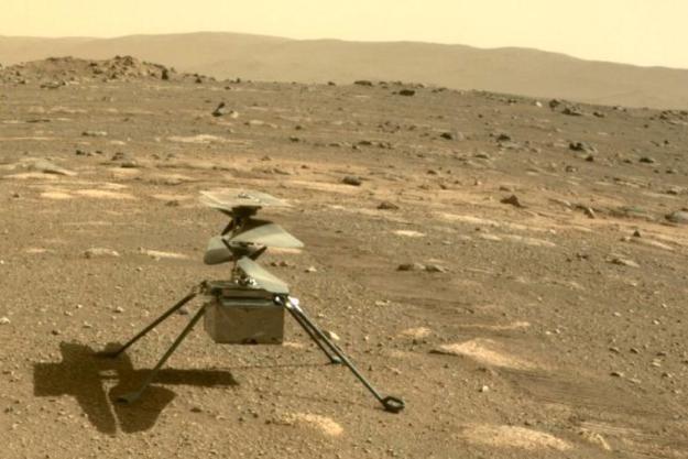 The Ingenuity helicopter is pictured on the surface of Mars.