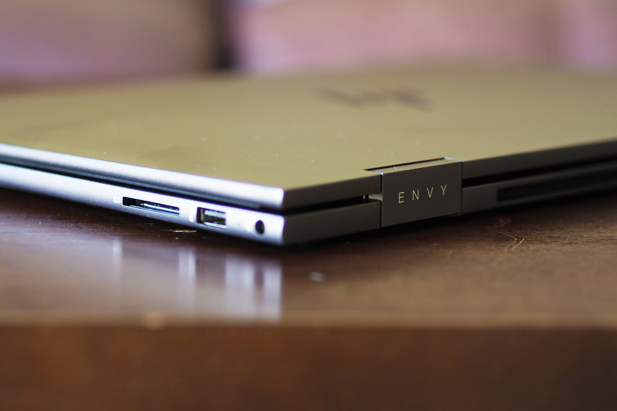 HP Envy x360 15 side view showing ports and back of chassis.
