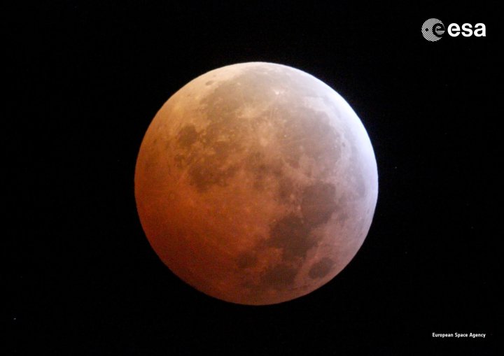 Image of the moon cast in a red-orange tint during a previous lunar eclipse in 2019.