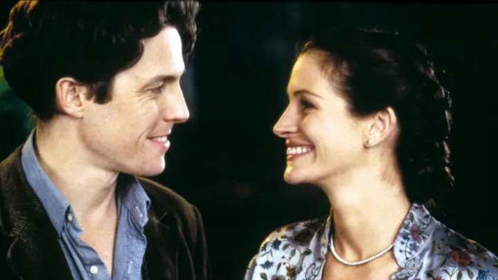 Hugh Grant and Julia Roberts stare at each other in Notting Hill.