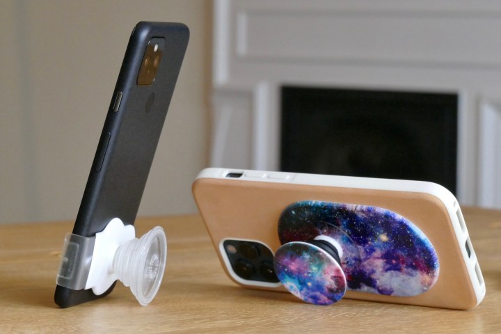 PopGrips attached to two iPhones.
