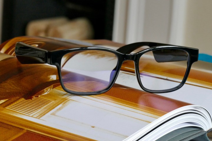 The Razer Anzu smart glasses placed on top of an open book.