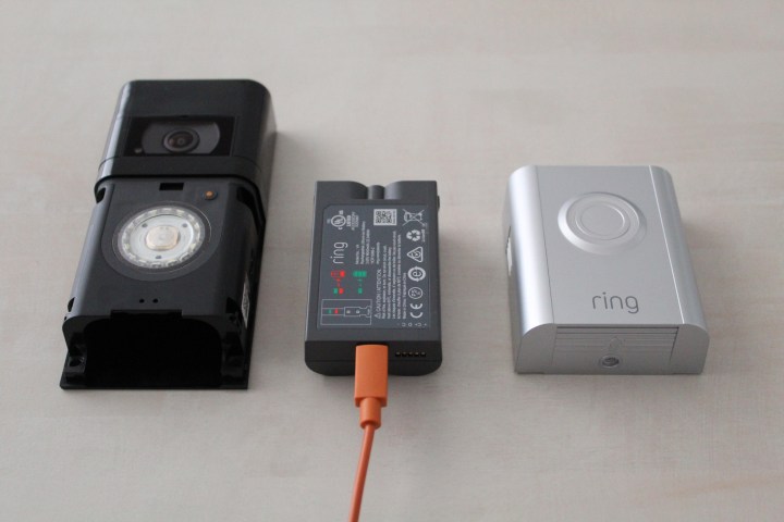 A Ring doorbell battery on a countertop.