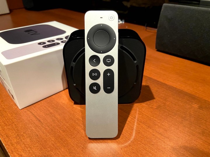 An Apple TV 4K Gen 2 with new Siri remote sit on a table.
