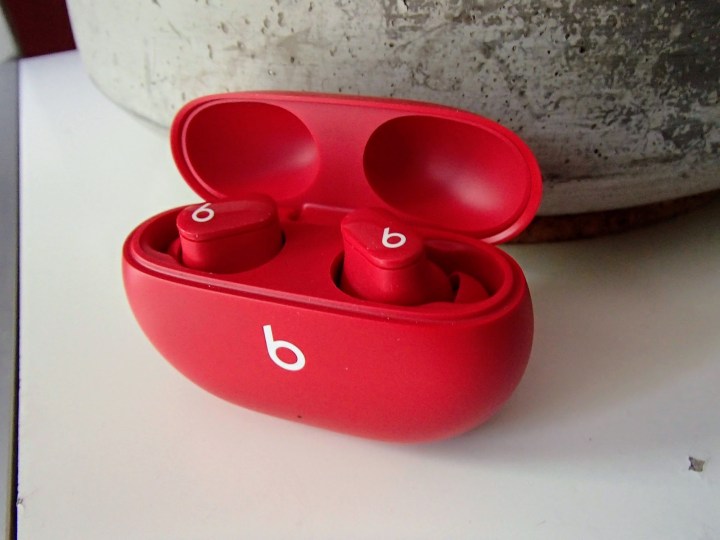 The Beats Studio Buds in their charging case.