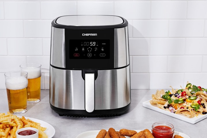 The Chefman TurboFry air fryer surrounded by food that it cooked.