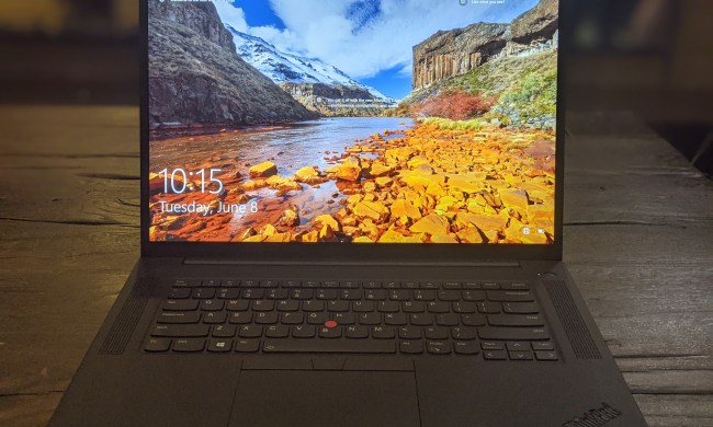 The fourth-generation Lenovo Thinkpad P1 with a nature scene on the display.