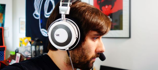 A man wearing the VZR Model One headphones.