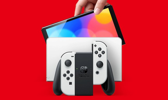 A Switch Oled sits in front of a right background.
