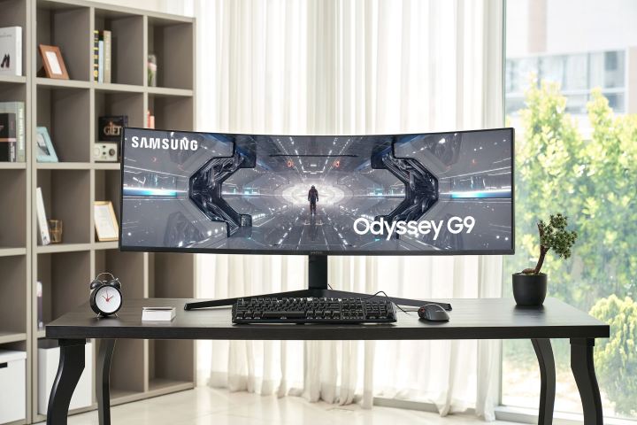 Front view of Samsung's new QLED Odyssey gaming monitor sitting on a table.