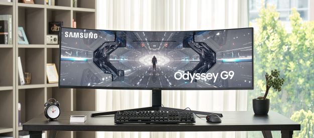 Front view of Samsung's new QLED Odyssey gaming monitor sitting on desk.
