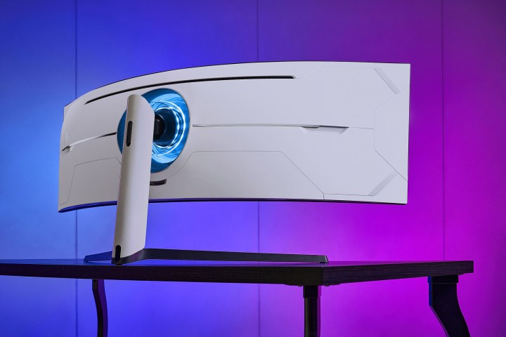 Back view of Samsung's new QLED Odyssey gaming monitor sitting on desk.