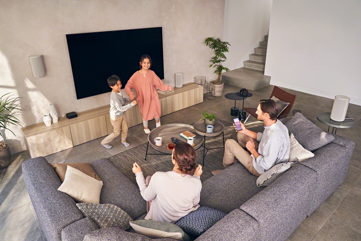 Family with Sony HT-A9 home theater system.