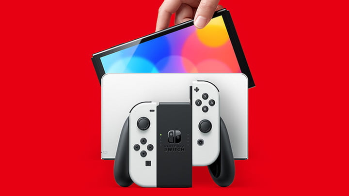 Nintendo Switch And Small Nintendo Switch Lite Comparison Of Two Handheld  Game Consoles Stock Photo - Download Image Now - iStock